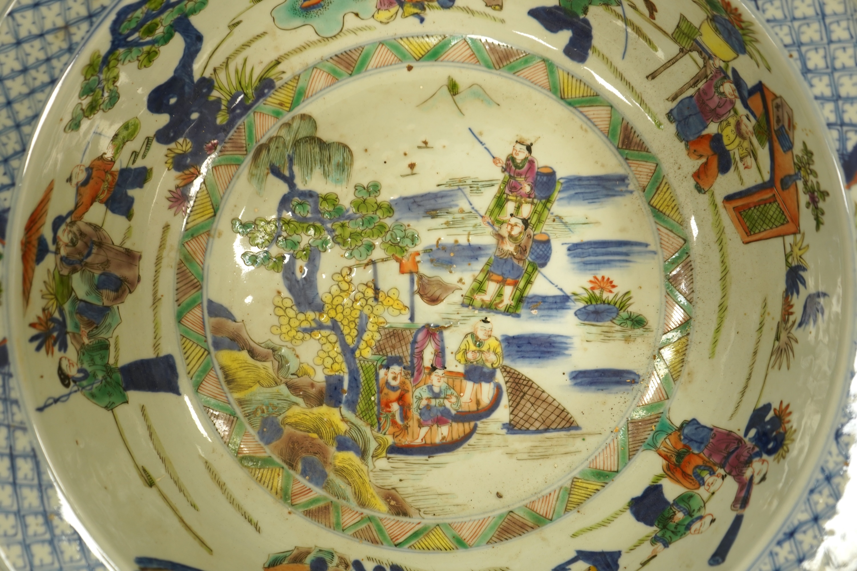 A large Chinese porcelain basin enamelled with figures, 41cm in diameter